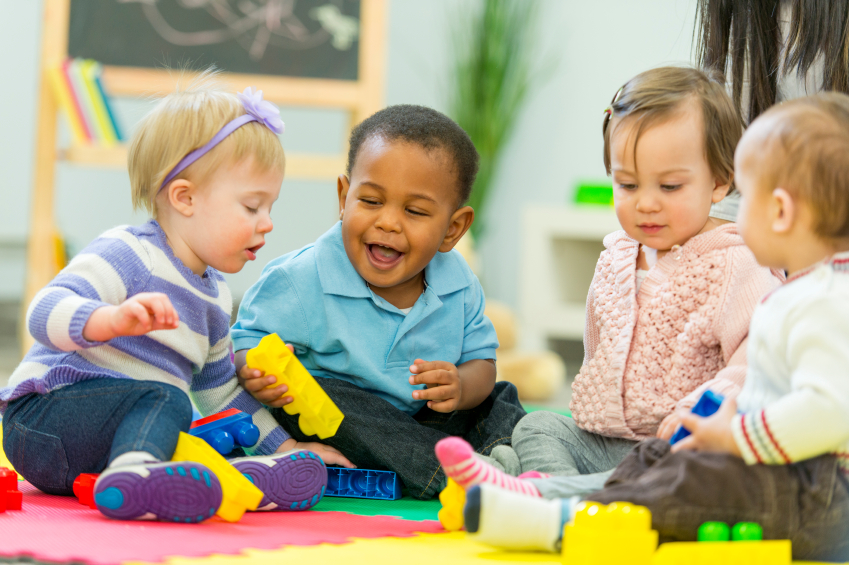 Group of babies playing together.